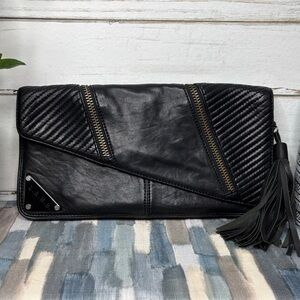 Gwen Stefani’s L.A.M.B Black Leather Clutch with Tassel